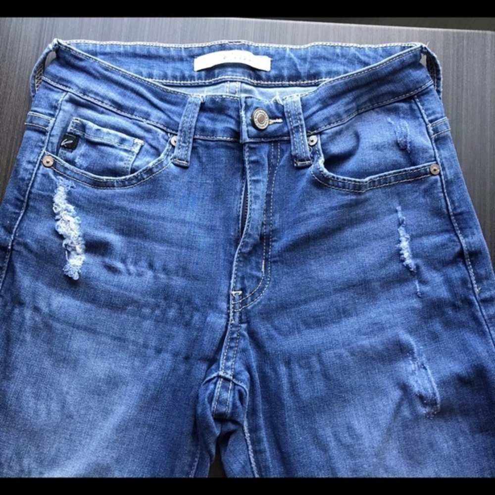 Kancan size 5 blue jeans, 5 pockets, raw hems, holes and scrapes.